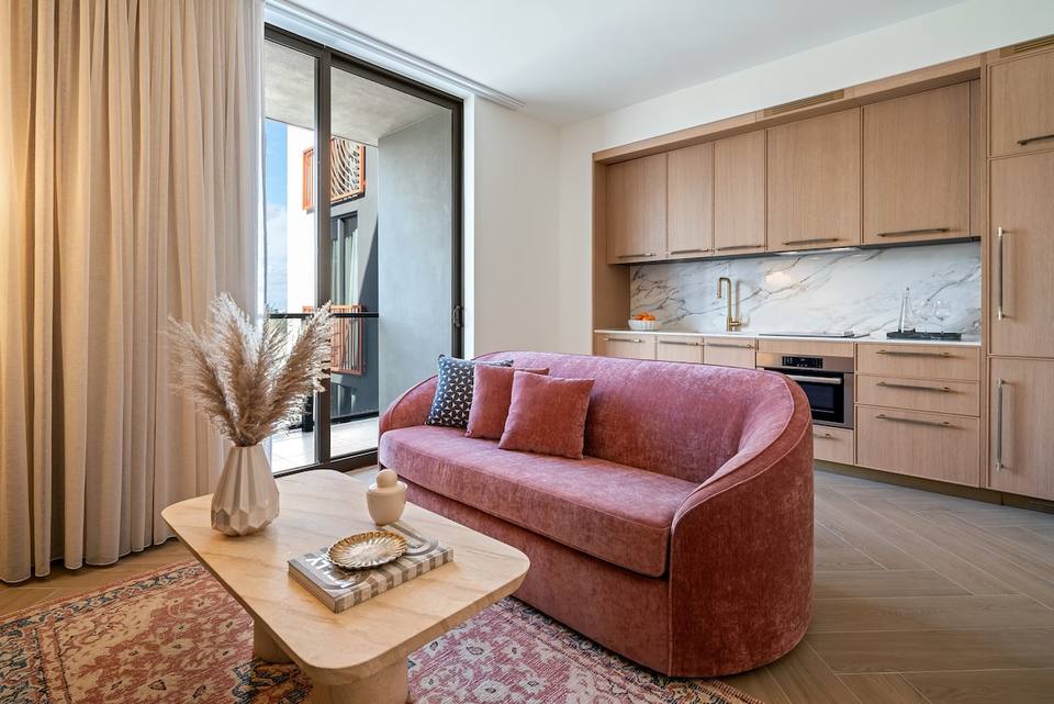 Modern, bright living room with balcony access