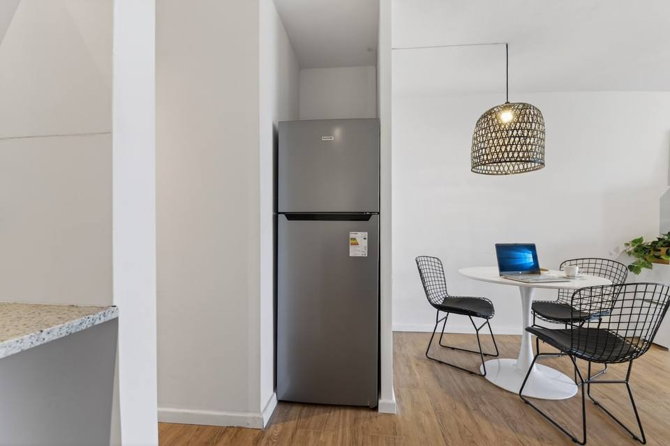 Fridge and dining area with round table