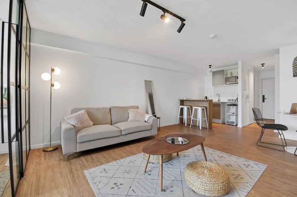 Living room and integrated kitchen with breakfast bar