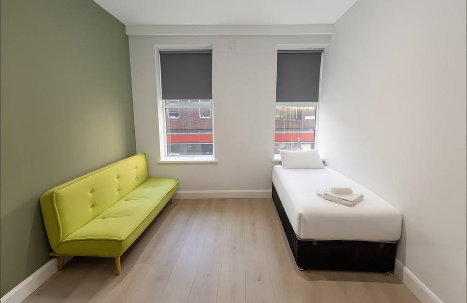 Additional living area with sofa and twin bed