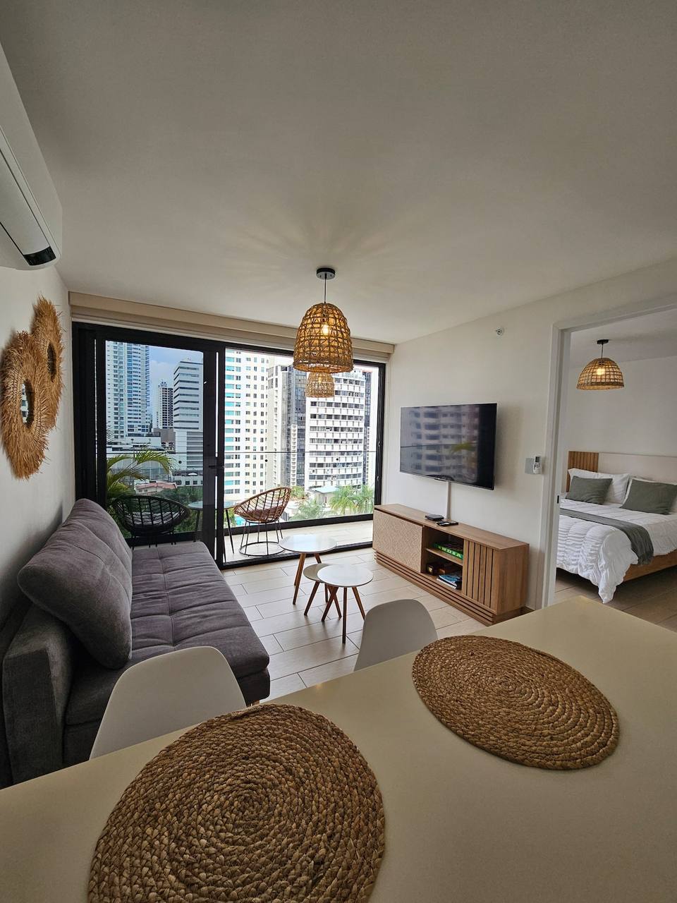 Modern, bright living room with balcony access