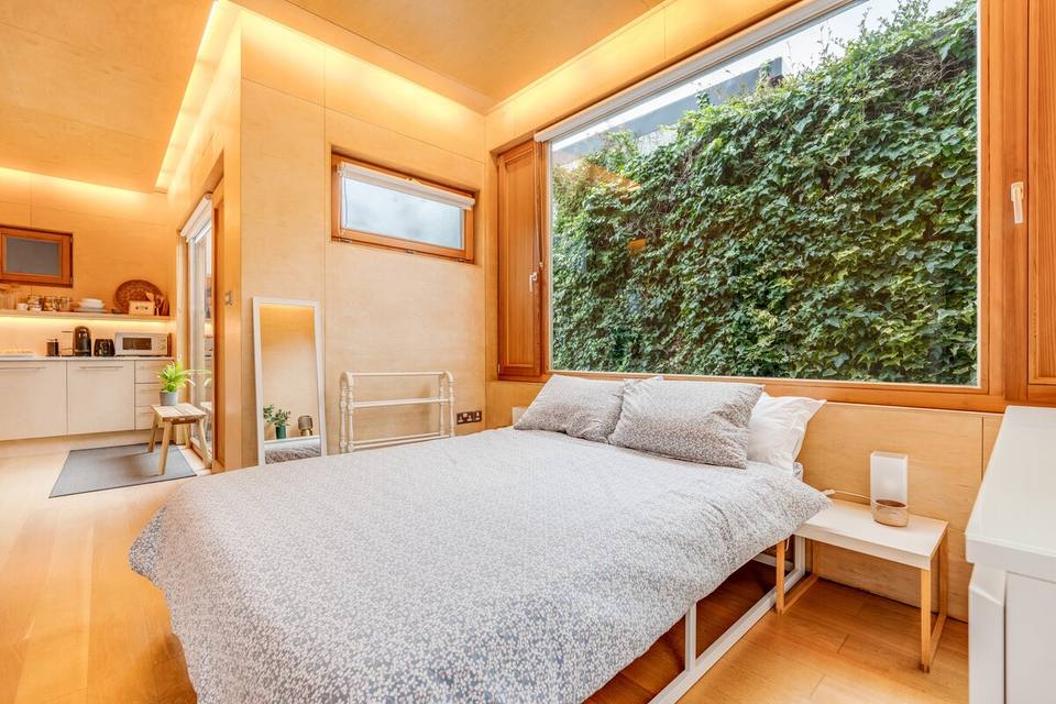 Bright bedroom with wood design and high ceilings