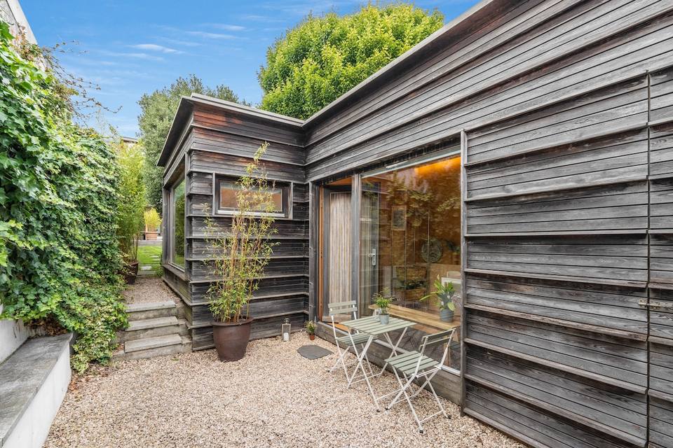 Modern wood facade in a garden setting